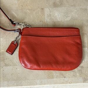 Coach rust colored wristlet NWOT